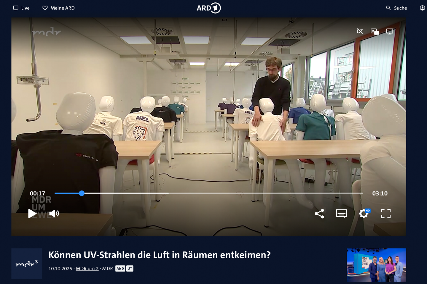 Screenshot von MDR Video mit Simulationsmodell eines Klassenraum mit Modellpuppen, Link führt zum MDR-Video